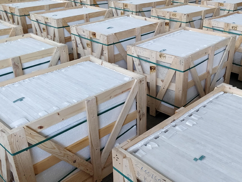 ISPM-15 compliant wooden crates with foam-protected natural stone tiles prepared for international shipping under Como Tiles Quality Assurance Protocol